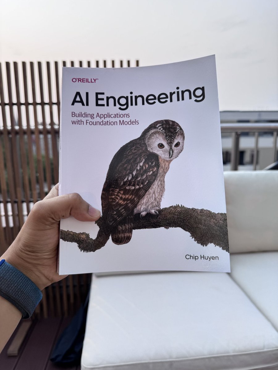 TruthScan detected a 1% chance this hand holding book on AI engineering with foundation models is AI-generated. Posted by @thegeeknarrator